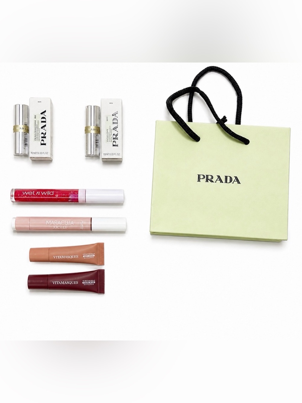 Prada Green Gift Bag with Assorted Women’s Lip Colors